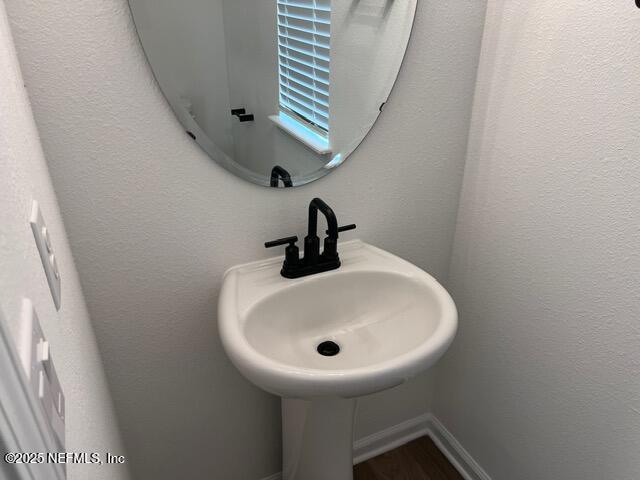 1177 Brk Frst Drive St. Augustine, FL 32092 - Photo 9 of 31 a bathroom with a sink and mirror