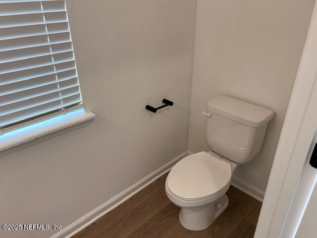 1177 Brk Frst Drive St. Augustine, FL 32092 - Photo 10 of 31 a white toilet sitting in a bathroom next to a sink