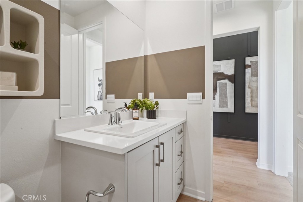 73634 Raphael Drive Palm Desert, CA 92211 - Photo 32 of 42 a bathroom with a sink and a mirror