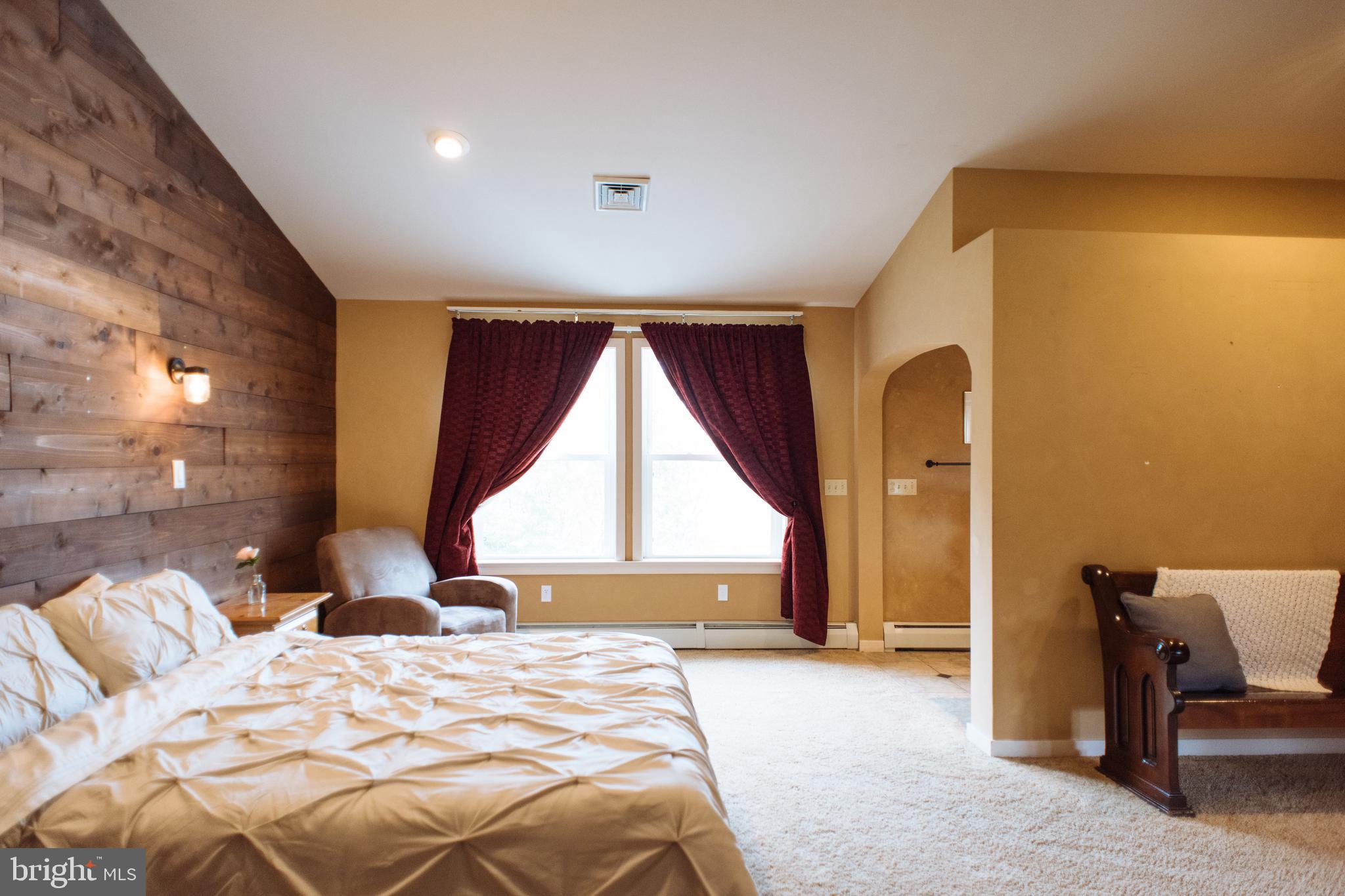 9448 Elizabethtown Road Elizabethtown, PA 17022 - Photo 22 of 48 a bed sitting in a spacious bedroom next to a window