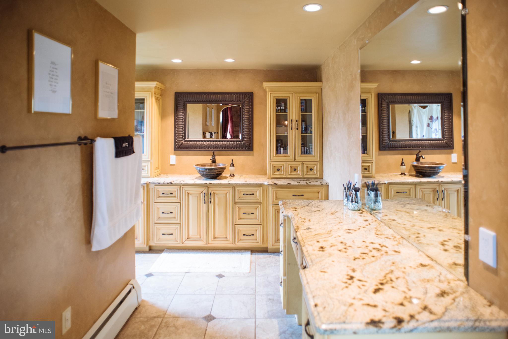 9448 Elizabethtown Road Elizabethtown, PA 17022 - Photo 25 of 48 a spacious bathroom with a tub sink and mirror