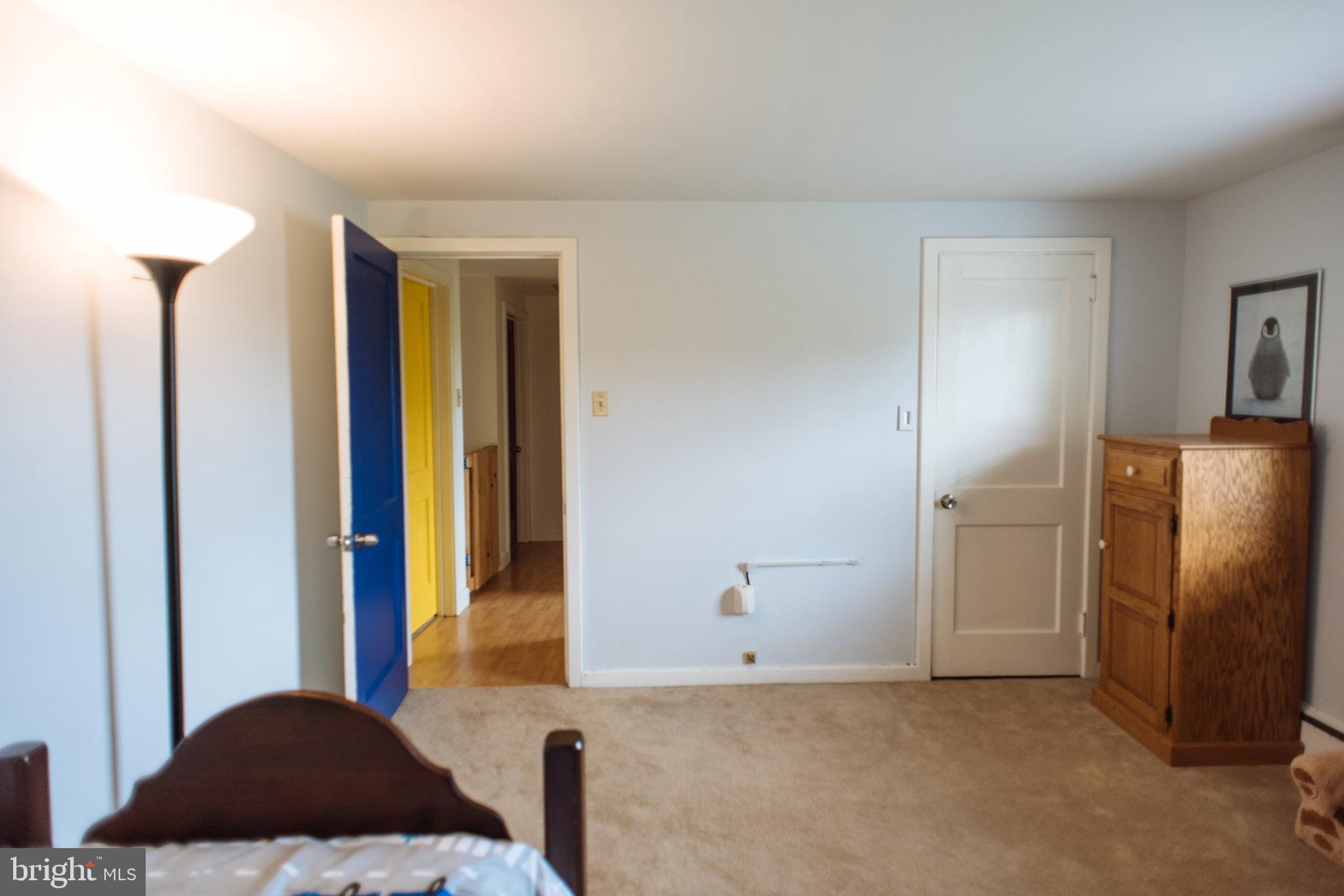 9448 Elizabethtown Road Elizabethtown, PA 17022 - Photo 29 of 48 a bedroom with a bed and a chandelier
