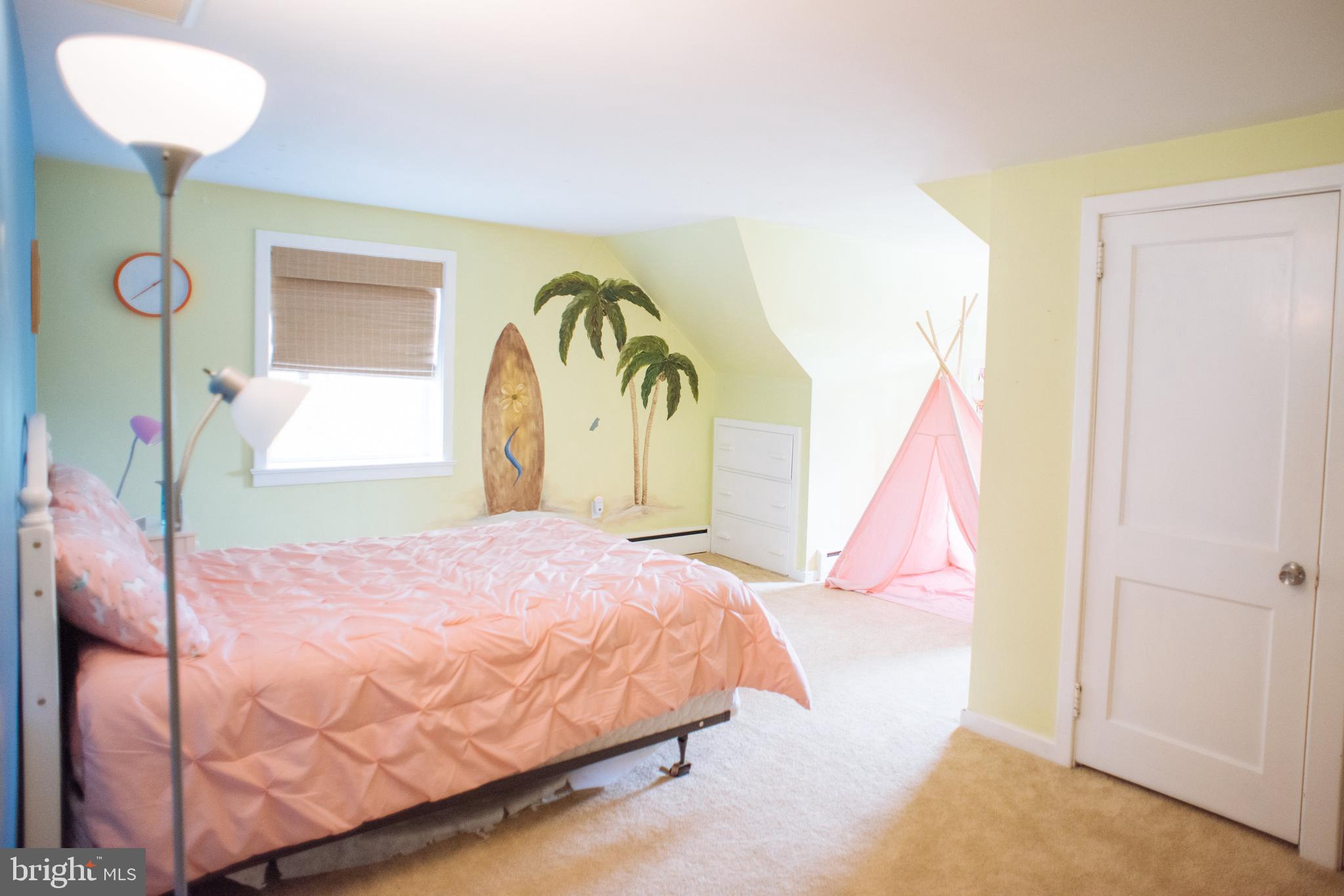 9448 Elizabethtown Road Elizabethtown, PA 17022 - Photo 31 of 48 a bedroom with a bed and a chandelier