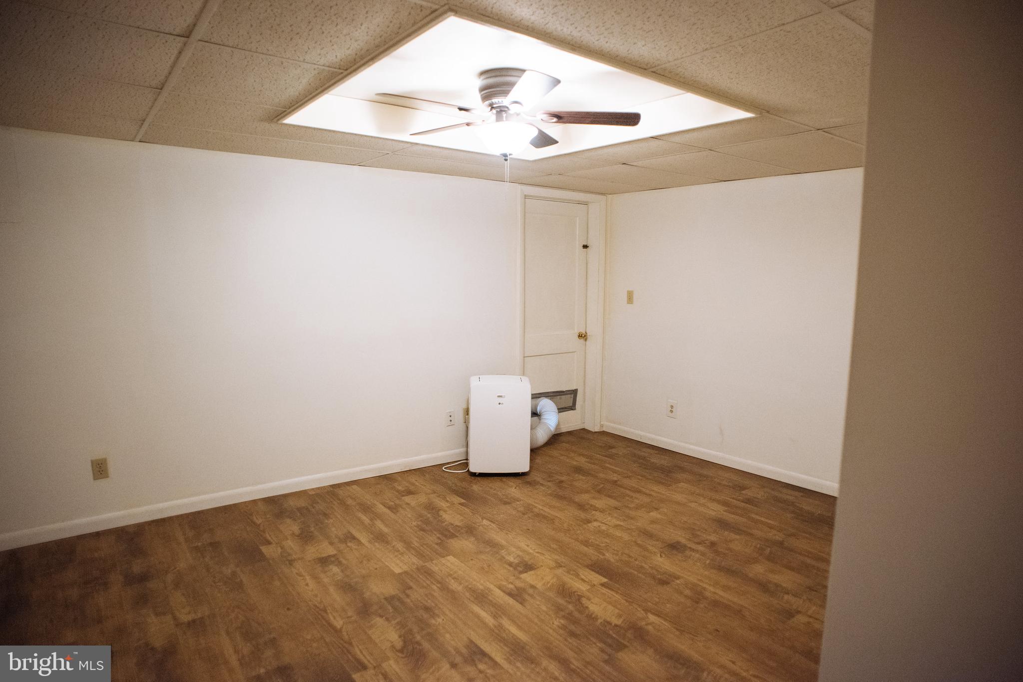 9448 Elizabethtown Road Elizabethtown, PA 17022 - Photo 35 of 48 an empty room with an entryway and chandelier