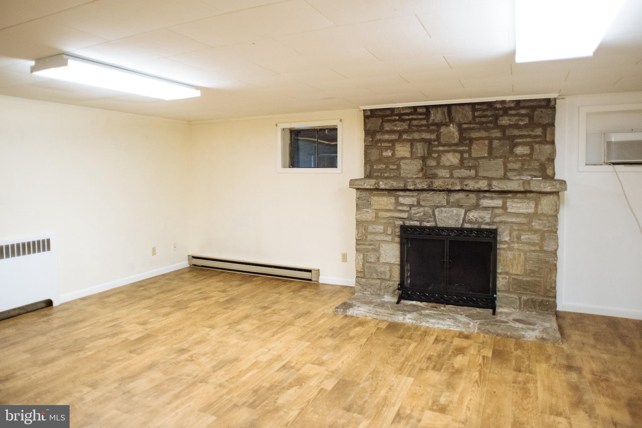 9448 Elizabethtown Road Elizabethtown, PA 17022 - Photo 37 of 48 a view of empty room with a fireplace