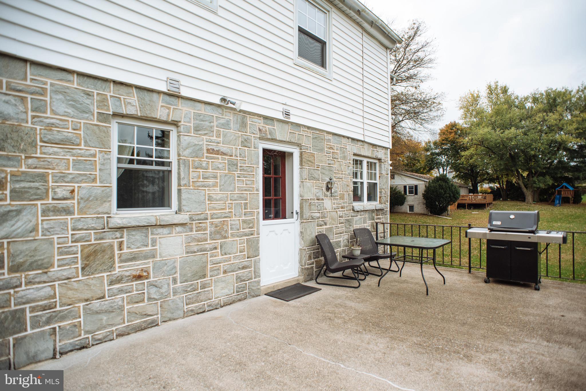 9448 Elizabethtown Road Elizabethtown, PA 17022 - Photo 43 of 48 a backyard of a house with outdoor seating and barbeque oven
