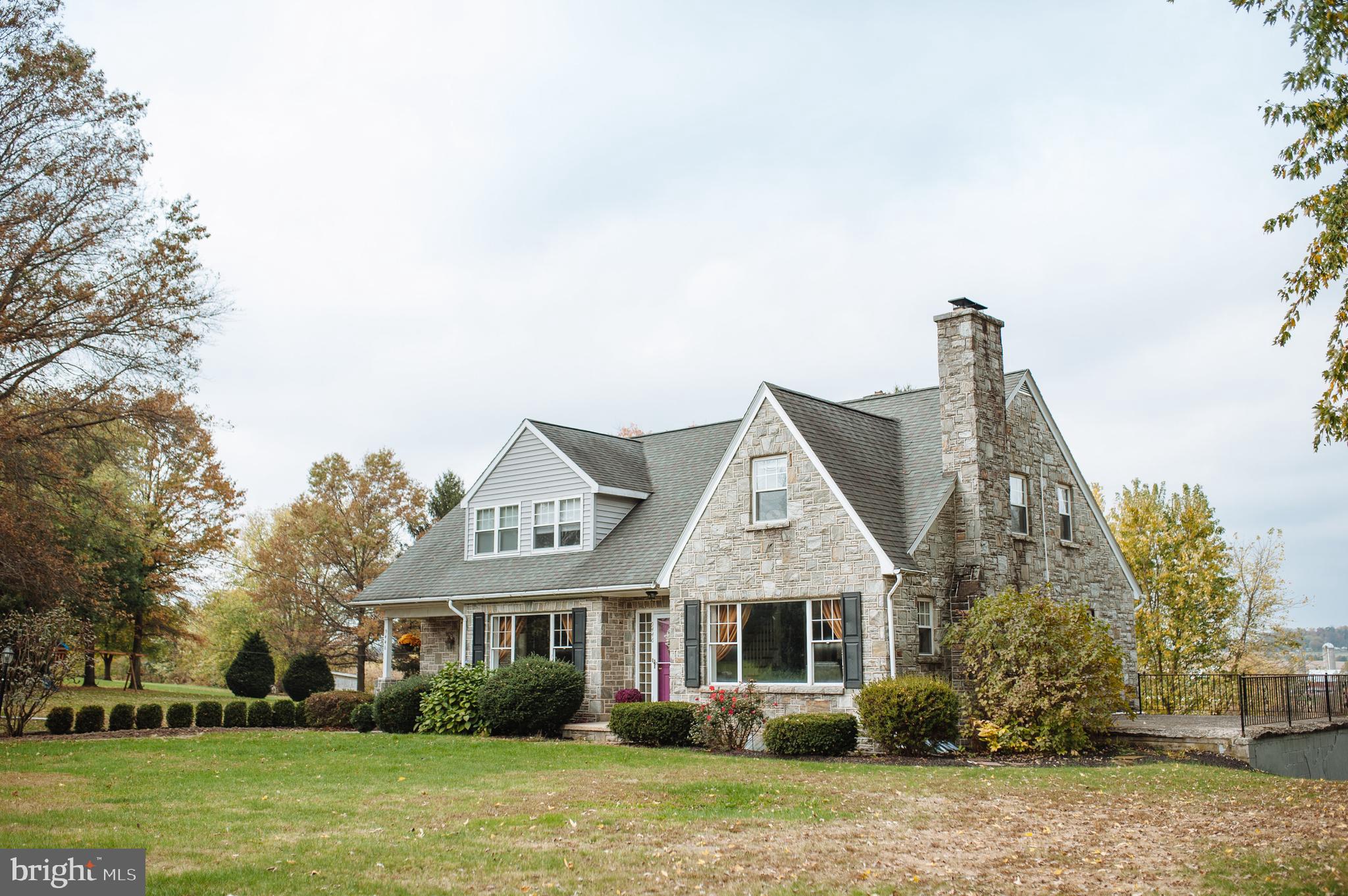 9448 Elizabethtown Road Elizabethtown, PA 17022 - Photo 47 of 48 a front view of a house with a garden