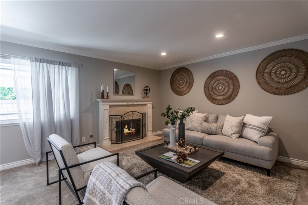 28009 Newbird Drive Saugus, CA 91350 - Photo 4 of 26 a living room with furniture a clock and a window