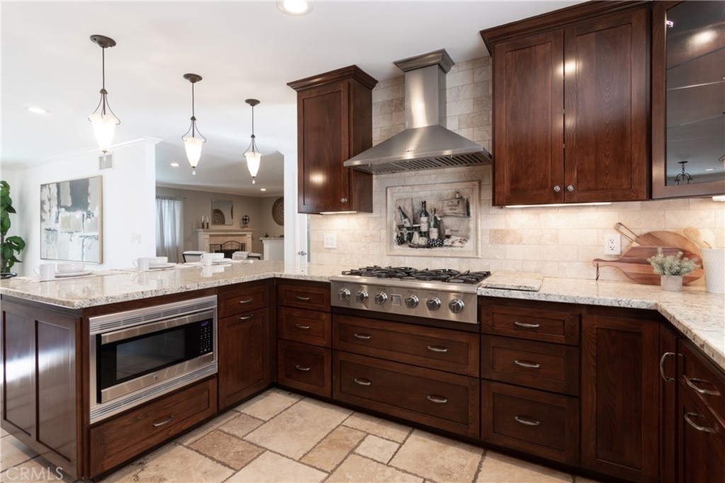28009 Newbird Drive Saugus, CA 91350 - Photo 8 of 26 a kitchen with a stove and a sink