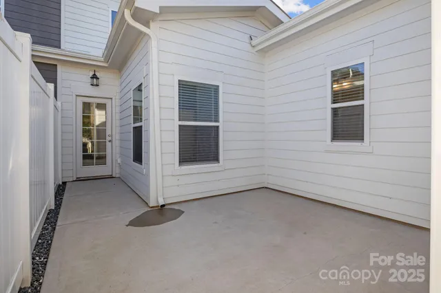 a view of an empty room with a fireplace