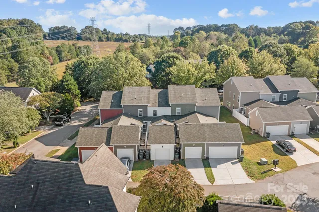 an aerial view of a house with a lake view