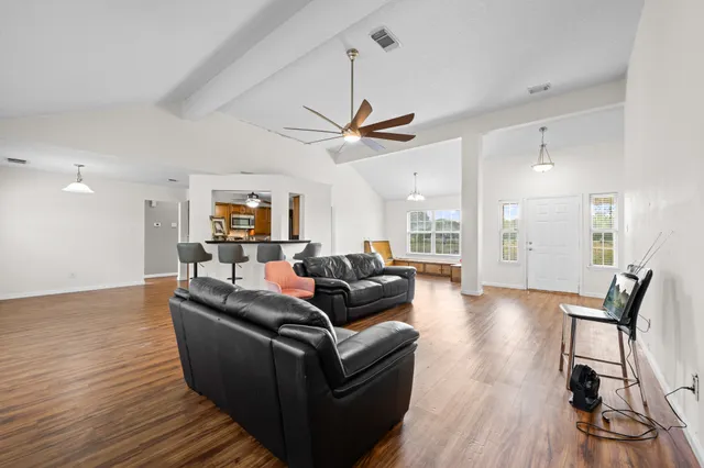 a living room with furniture and a large window