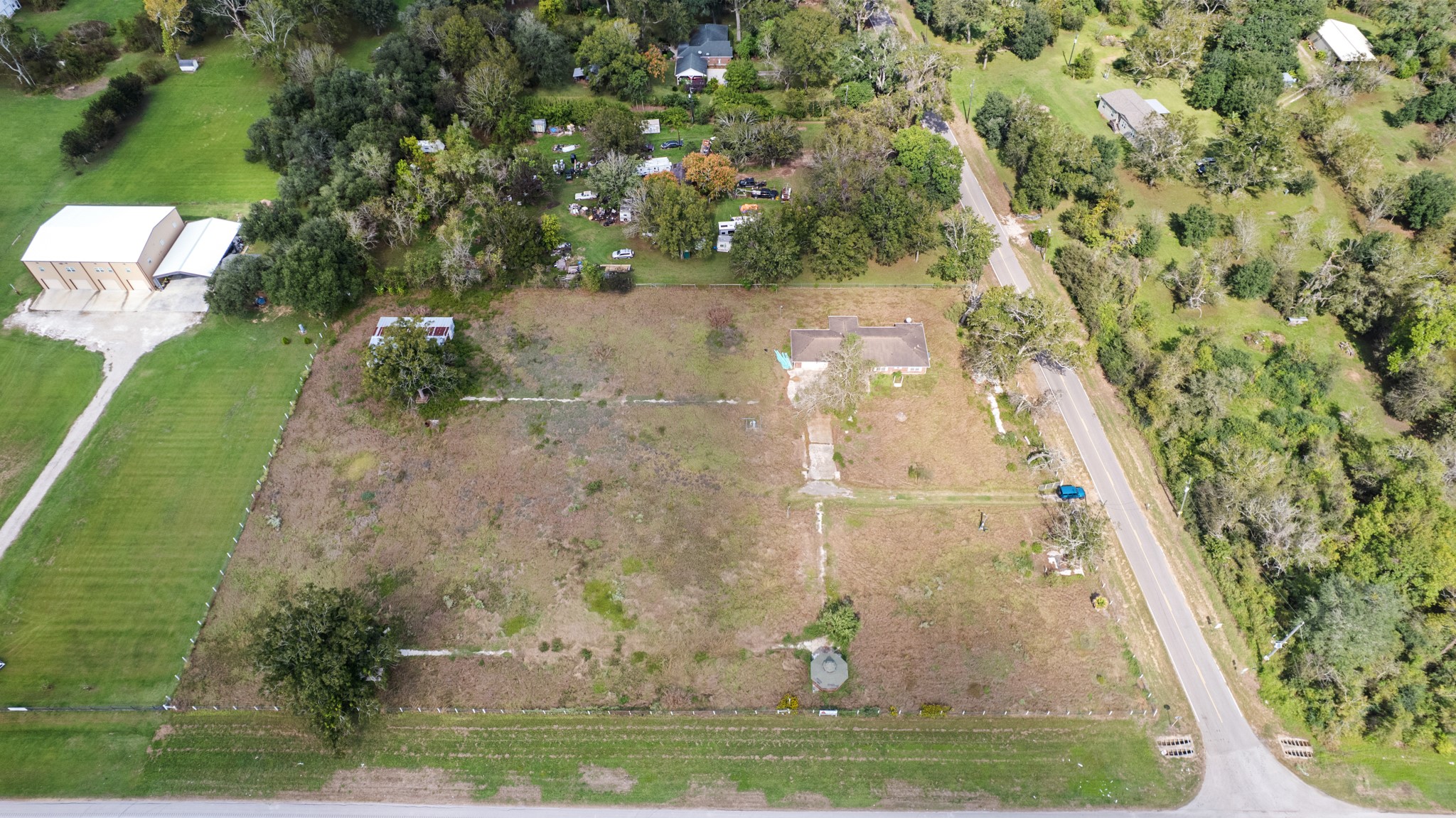 7442 County Road 42 Rosharon, TX 77583 - Photo 2 of 43 an aerial view of a residential houses with outdoor space