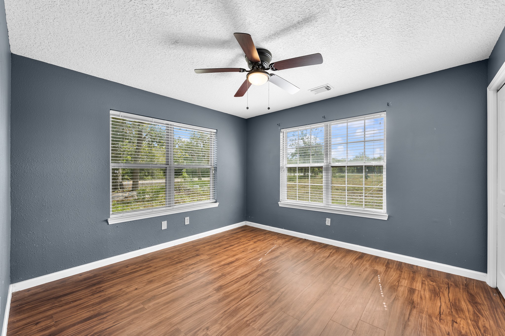 7442 County Road 42 Rosharon, TX 77583 - Photo 28 of 43 a view of an empty room with wooden floor and a window