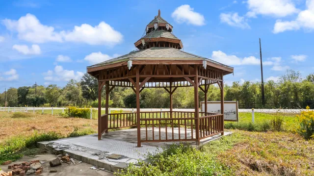 a view of a wrought iron fences in front of house