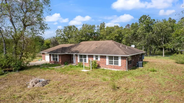 a house with trees in the background