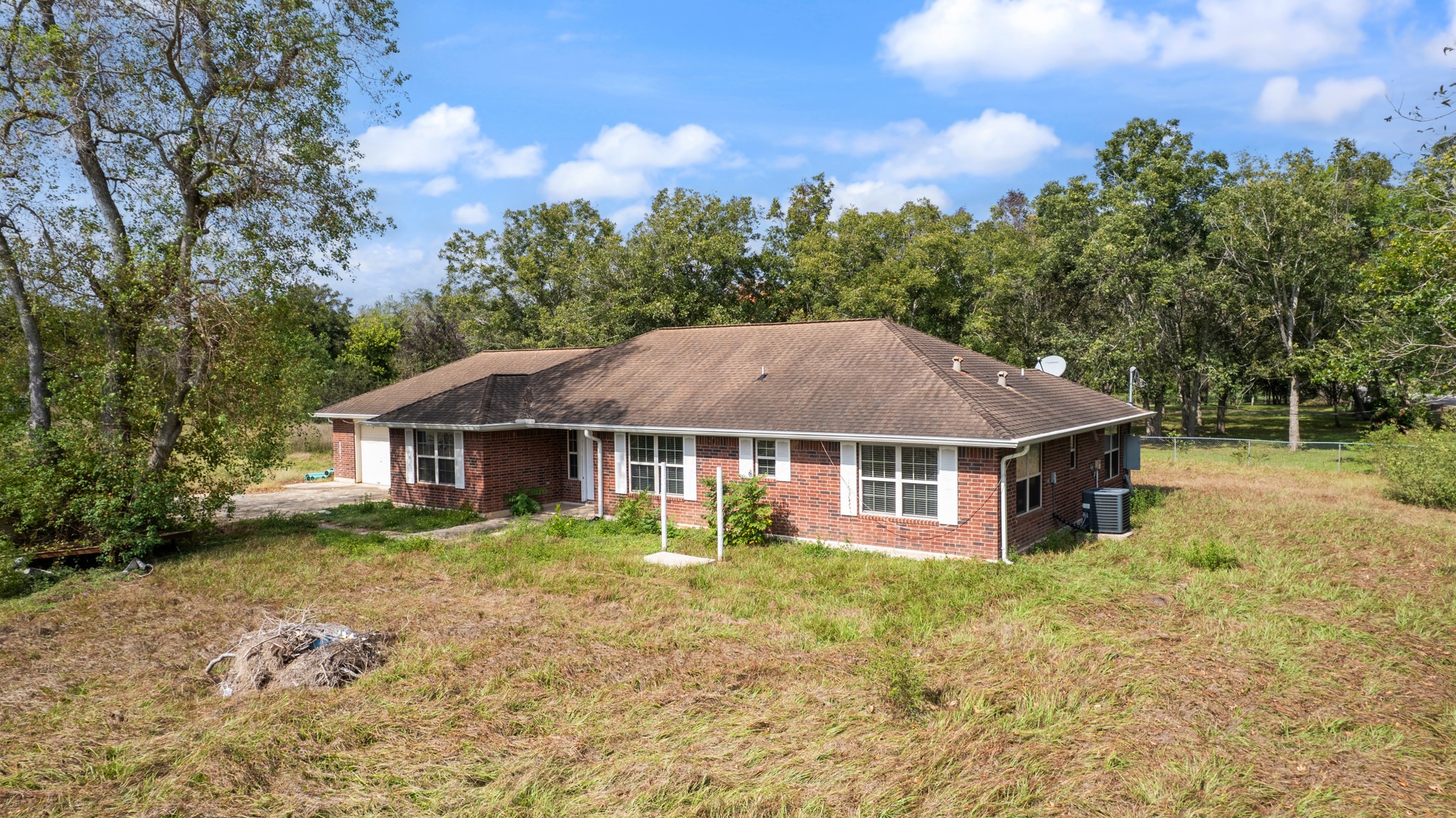 7442 County Road 42 Rosharon, TX 77583 - Photo 7 of 43 a house with trees in the background