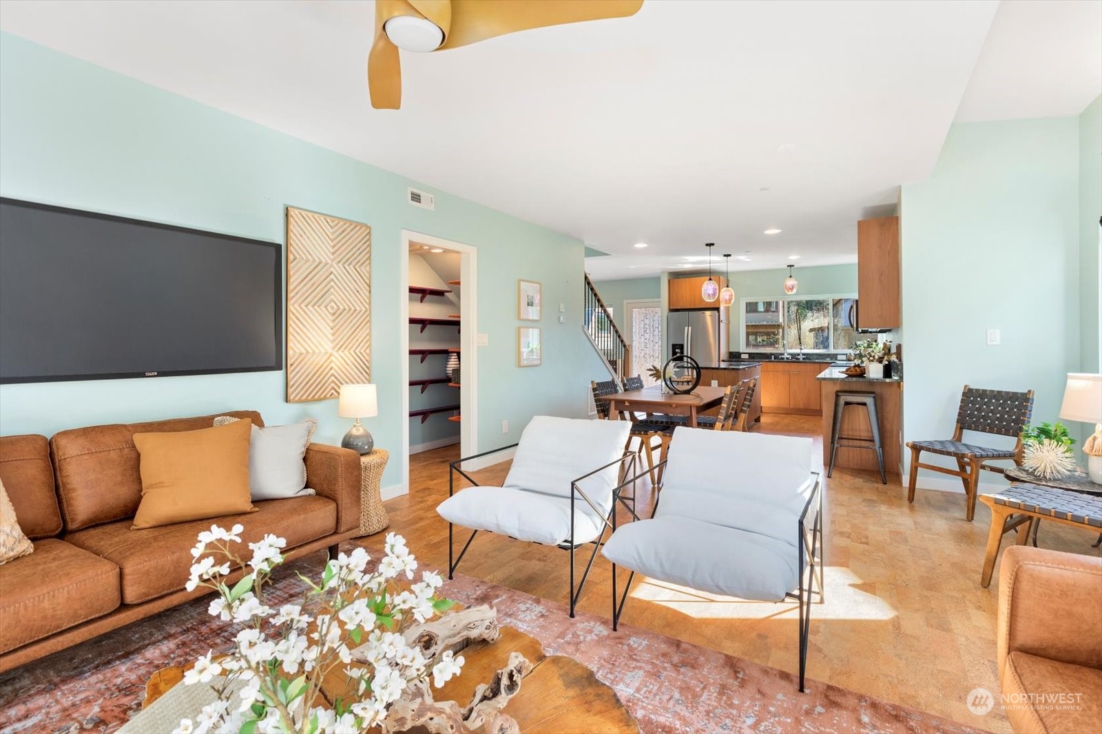 1402 194th Street Southeast, Unit 4 Bothell, WA 98012 - Photo 13 of 40 a living room with furniture kitchen view and a wooden floor