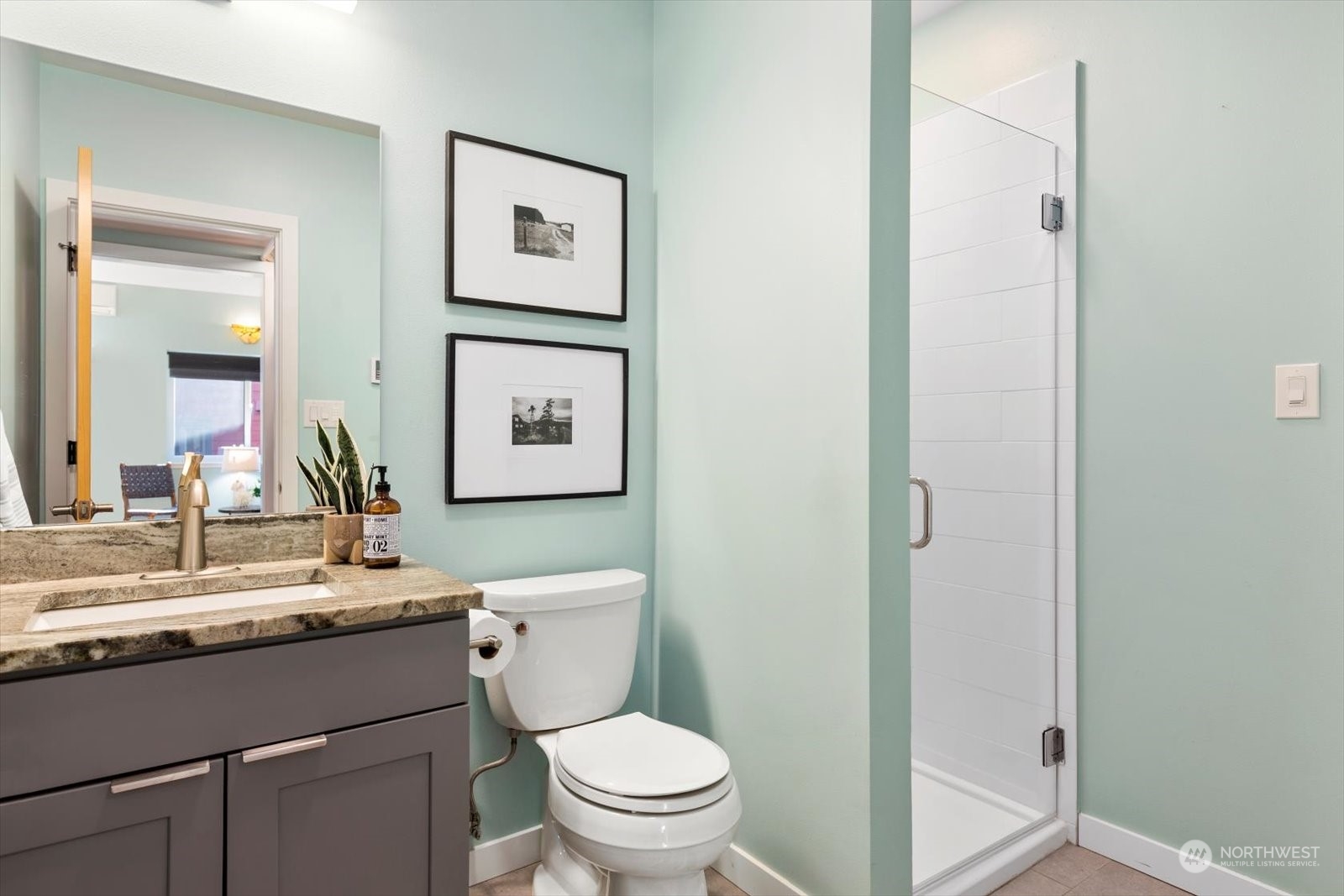 1402 194th Street Southeast, Unit 4 Bothell, WA 98012 - Photo 15 of 40 a bathroom with a toilet a sink and mirror