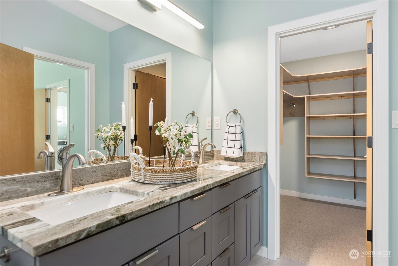 1402 194th Street Southeast, Unit 4 Bothell, WA 98012 - Photo 20 of 40 a bathroom with a granite countertop sink and a mirror