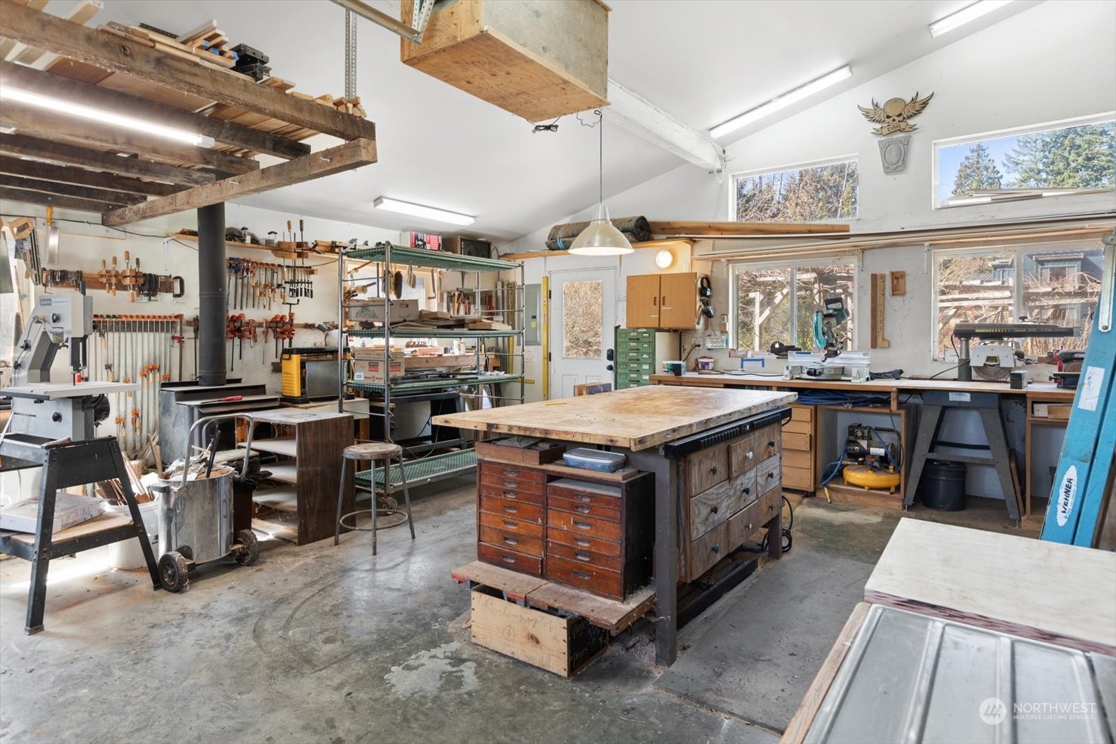1402 194th Street Southeast, Unit 4 Bothell, WA 98012 - Photo 34 of 40 a open kitchen with stainless steel appliances granite countertop a lot of counter and chairs
