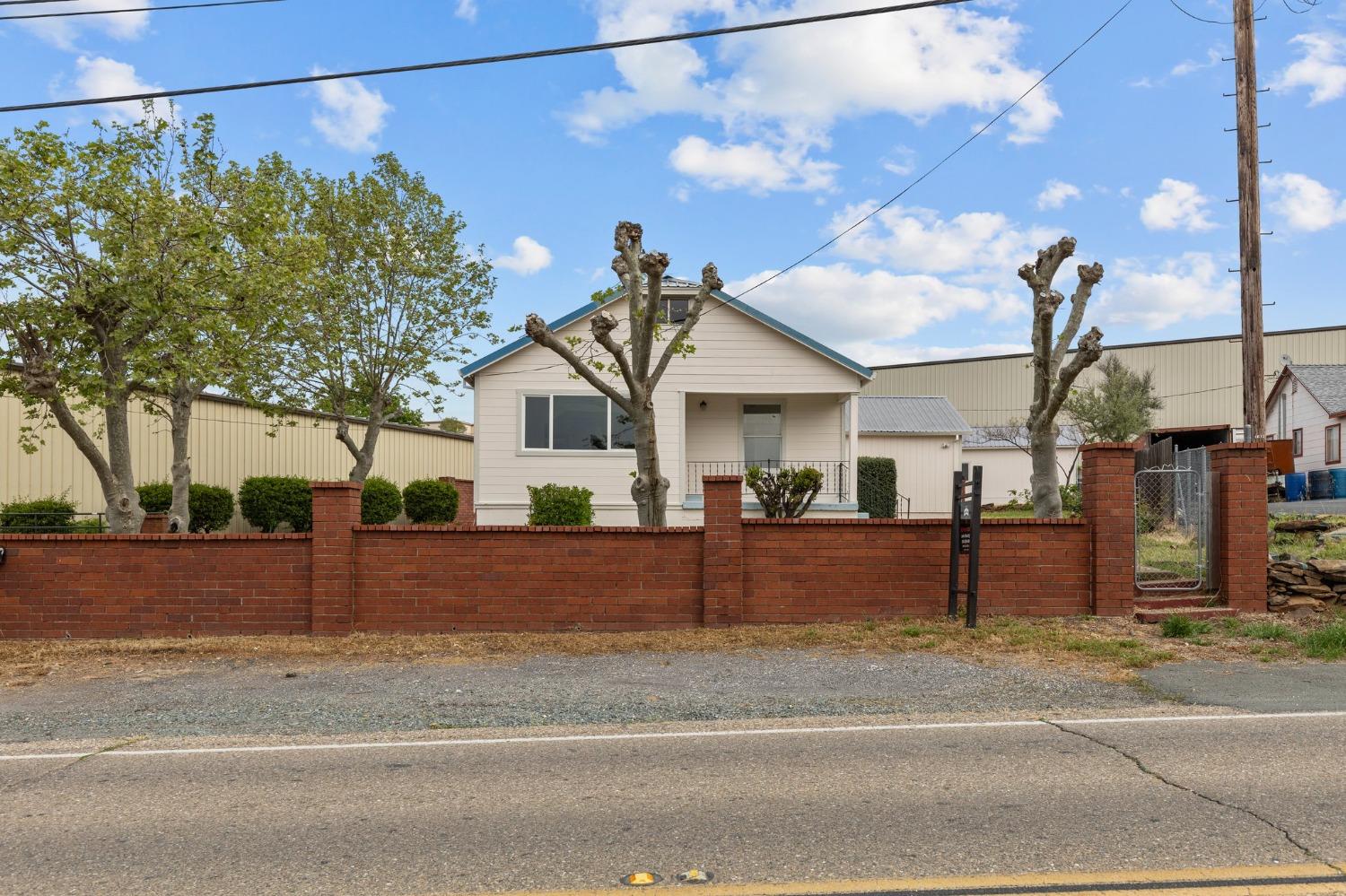 a view of a house with a street