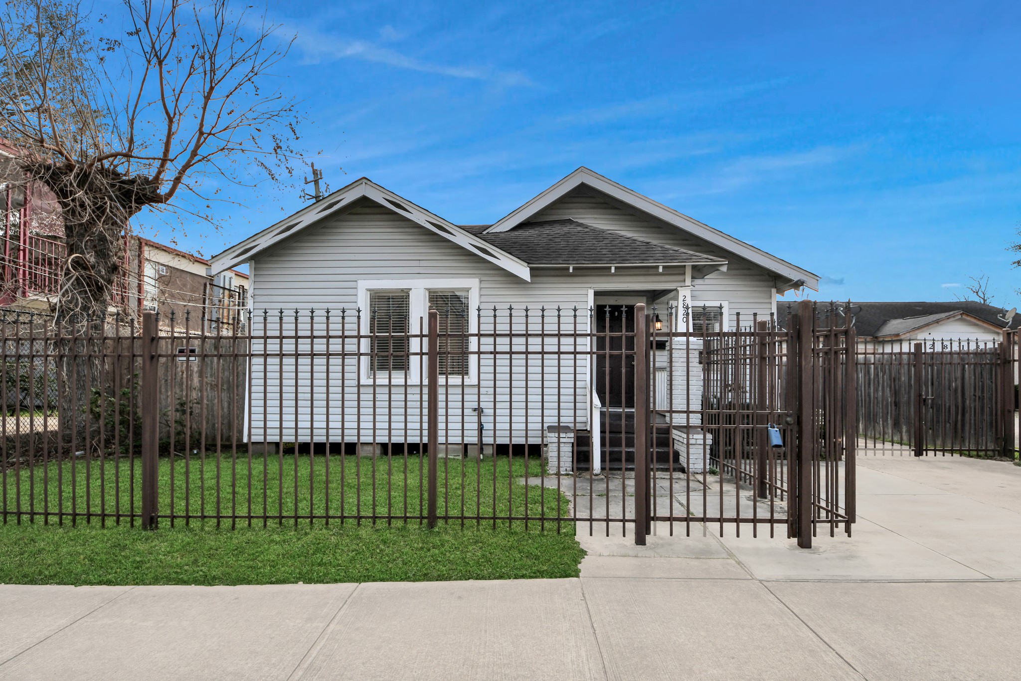 2820 Holman Street Houston, TX 77004 - Photo 2 of 38 a view of a house with a small yard and plants