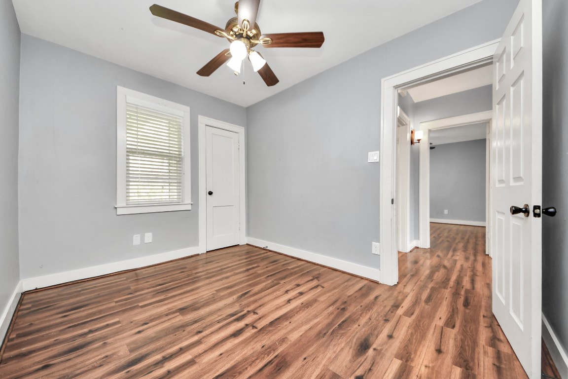 2820 Holman Street Houston, TX 77004 - Photo 22 of 38 wooden floor in an empty room with a window