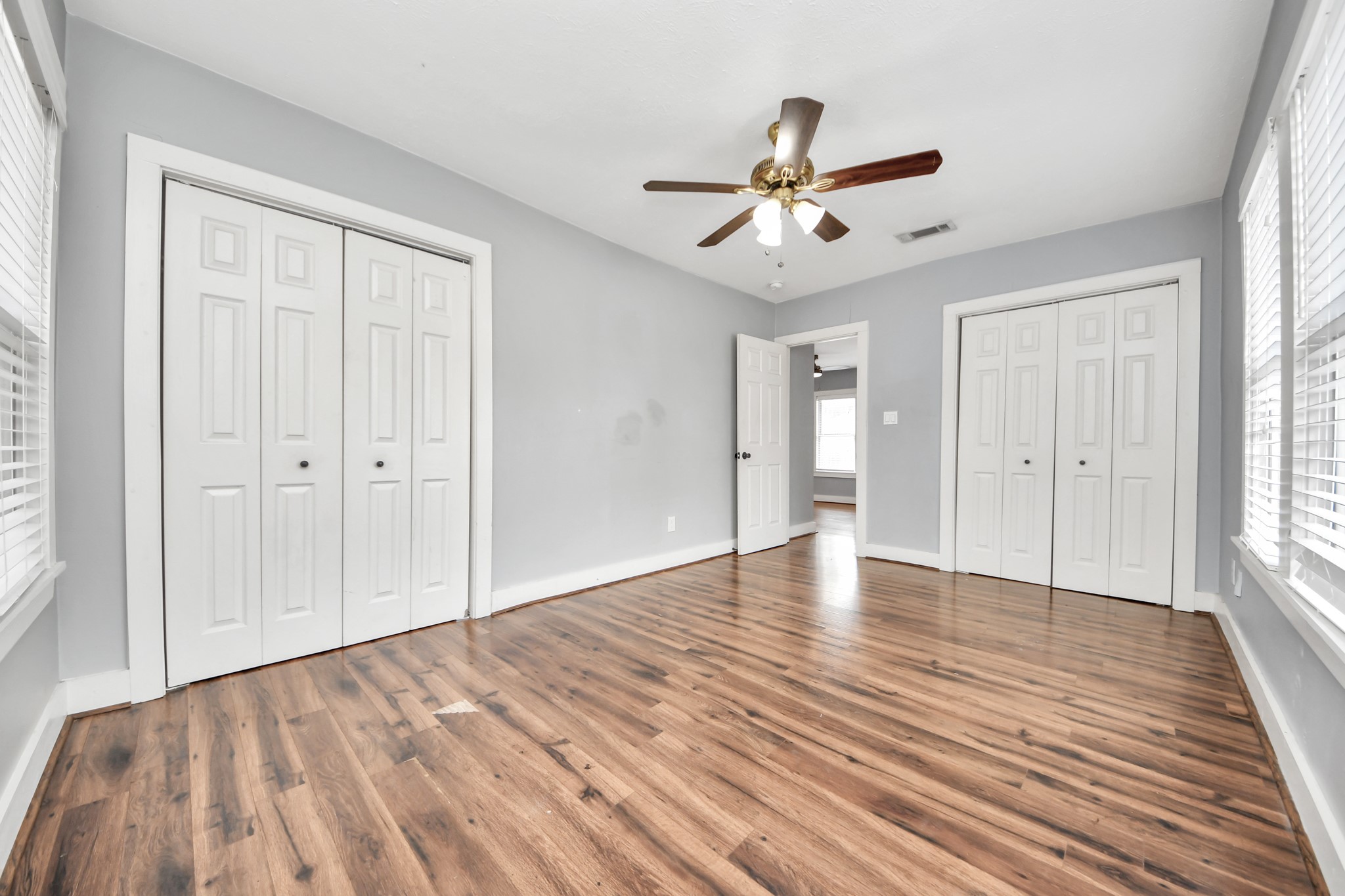 2820 Holman Street Houston, TX 77004 - Photo 6 of 38 Another angle of the first bedroom off the front entry way. Plenty of ample storage, ceiling fan and natural lighting.