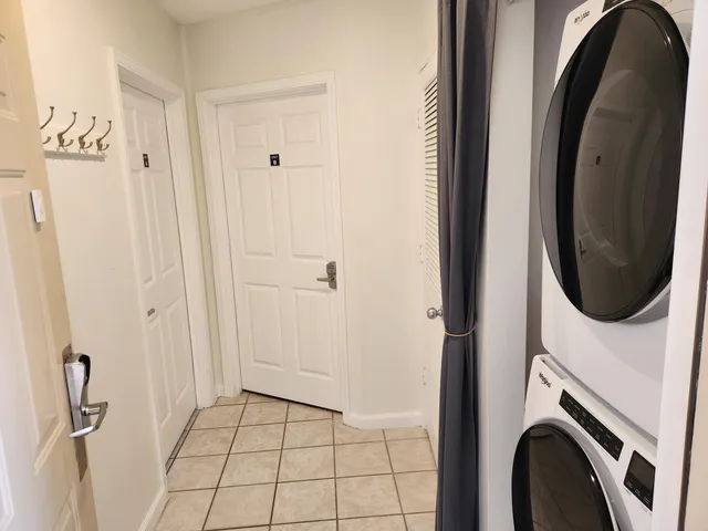 a view of a hallway with washer and dryer