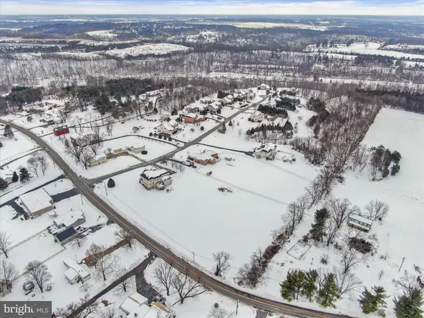 an aerial view of house with yard