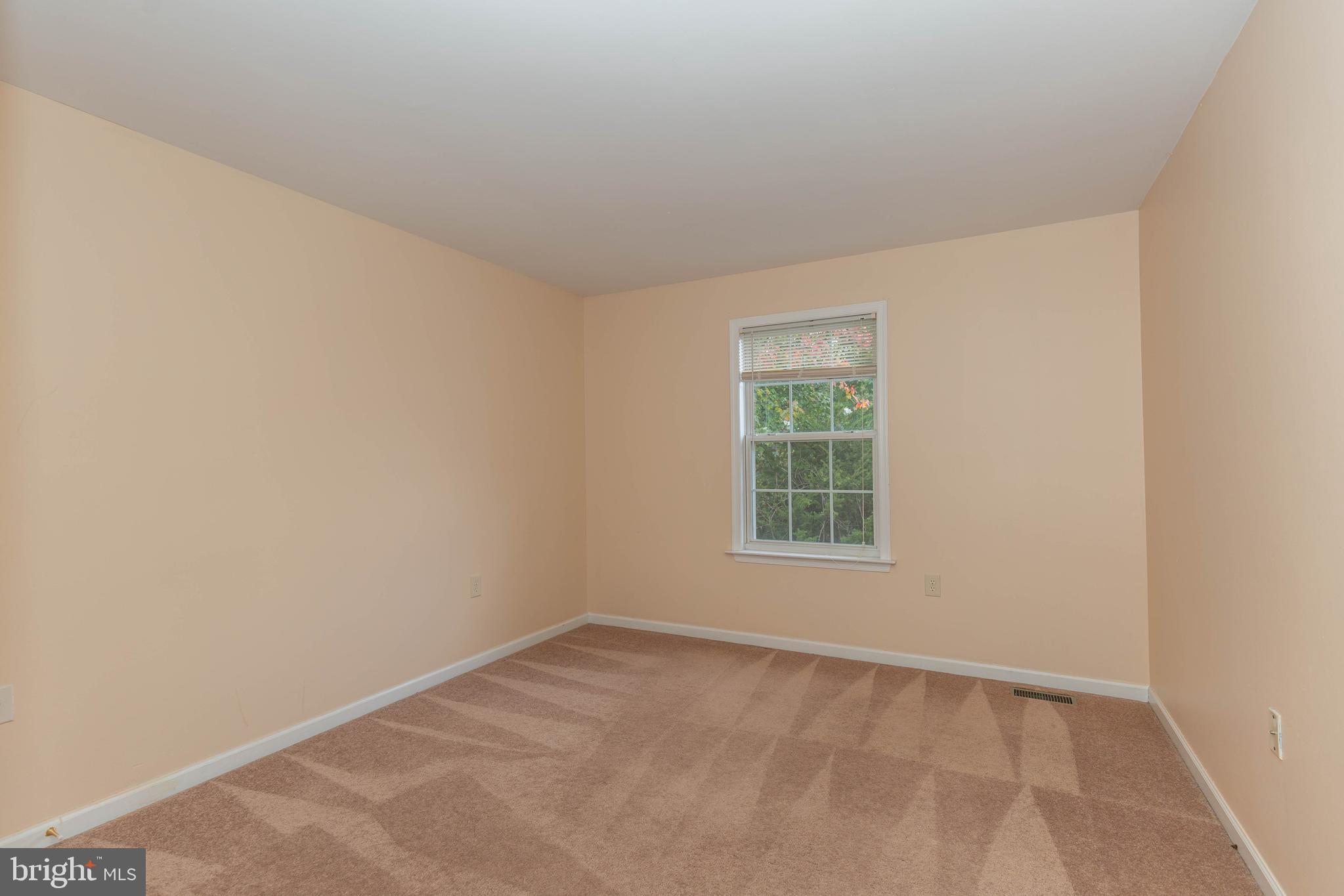 131 Cypress Point Drive Charles Town, WV 25414 - Photo 21 of 35 an empty room with a window