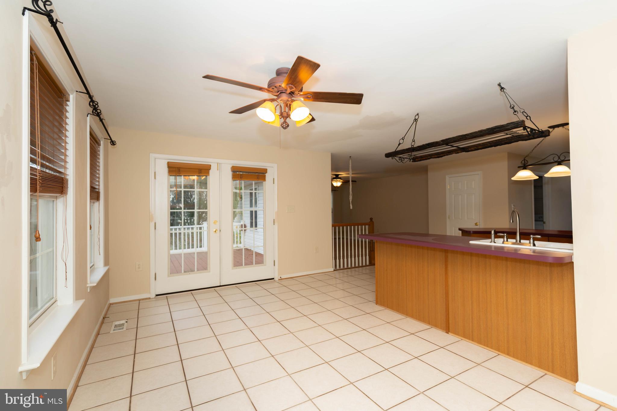 131 Cypress Point Drive Charles Town, WV 25414 - Photo 9 of 35 a view of a kitchen with furniture and a window