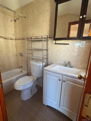 a bathroom with a toilet sink and a shower