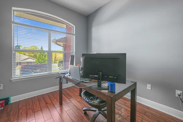 a workspace with furniture and a window