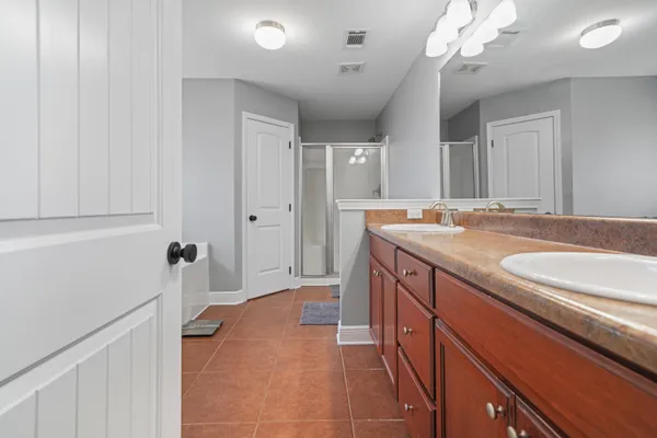 a bathroom with a sink a vanity and a mirror