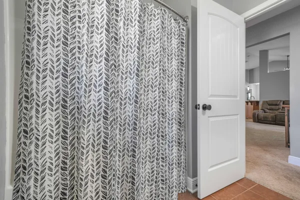 a bathroom with a shower curtain