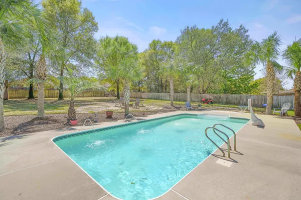 a view of a swimming pool with a patio
