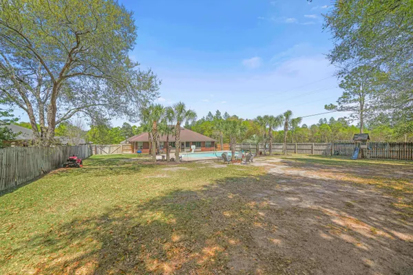 a view of a playground with basketball court