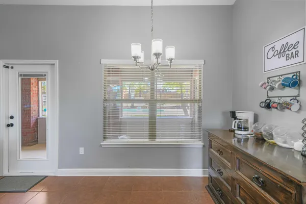 a kitchen with a sink cabinets and window