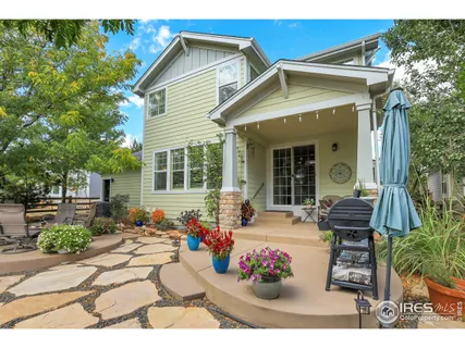 a front view of a house with outdoor seating