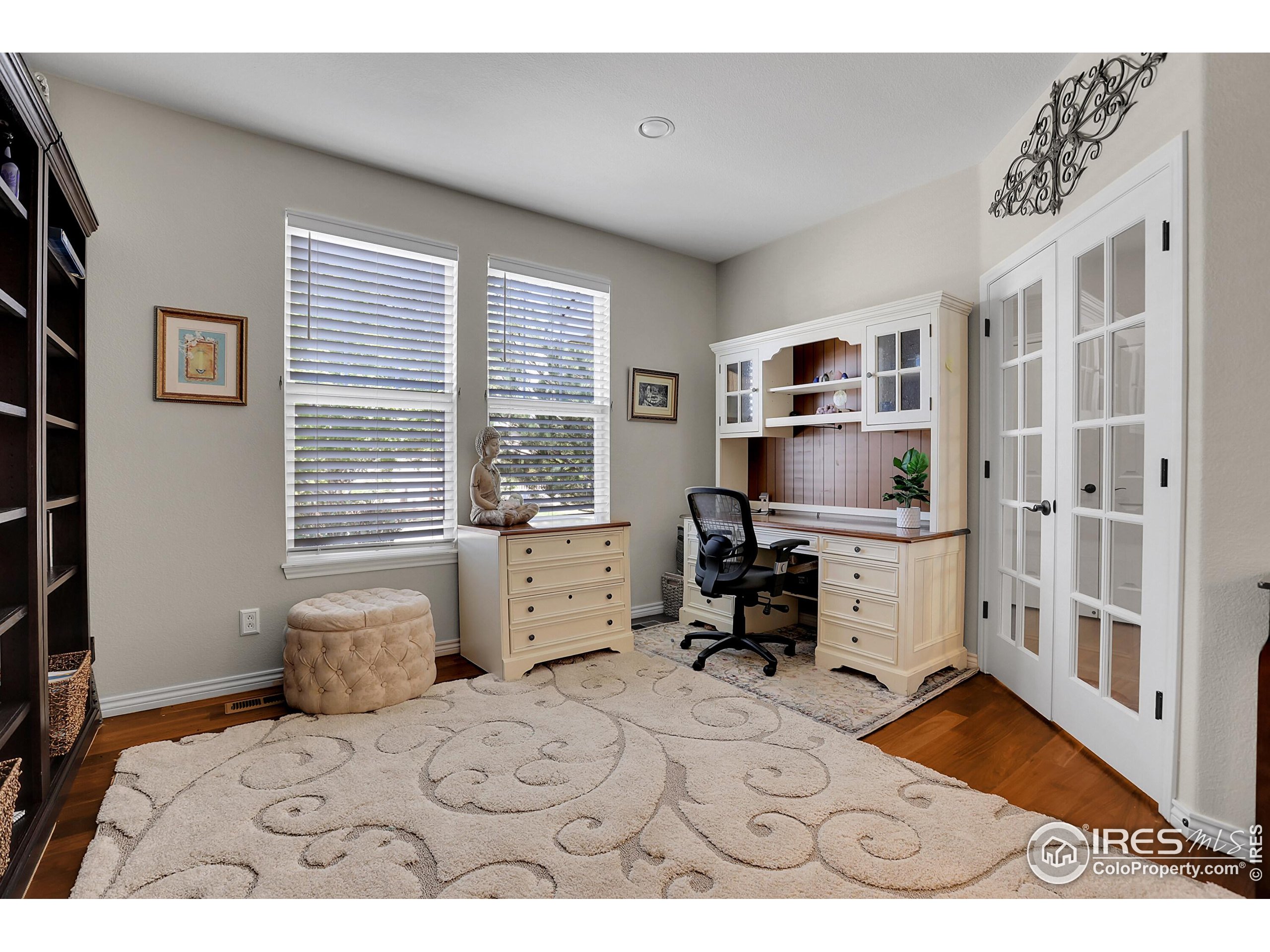 112 Austin Avenue Erie, CO 80516 - Photo 21 of 44 a bedroom with a bed and a large window