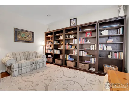 a living room with furniture cabinets and window