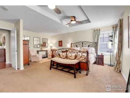 a bedroom with furniture and a fireplace