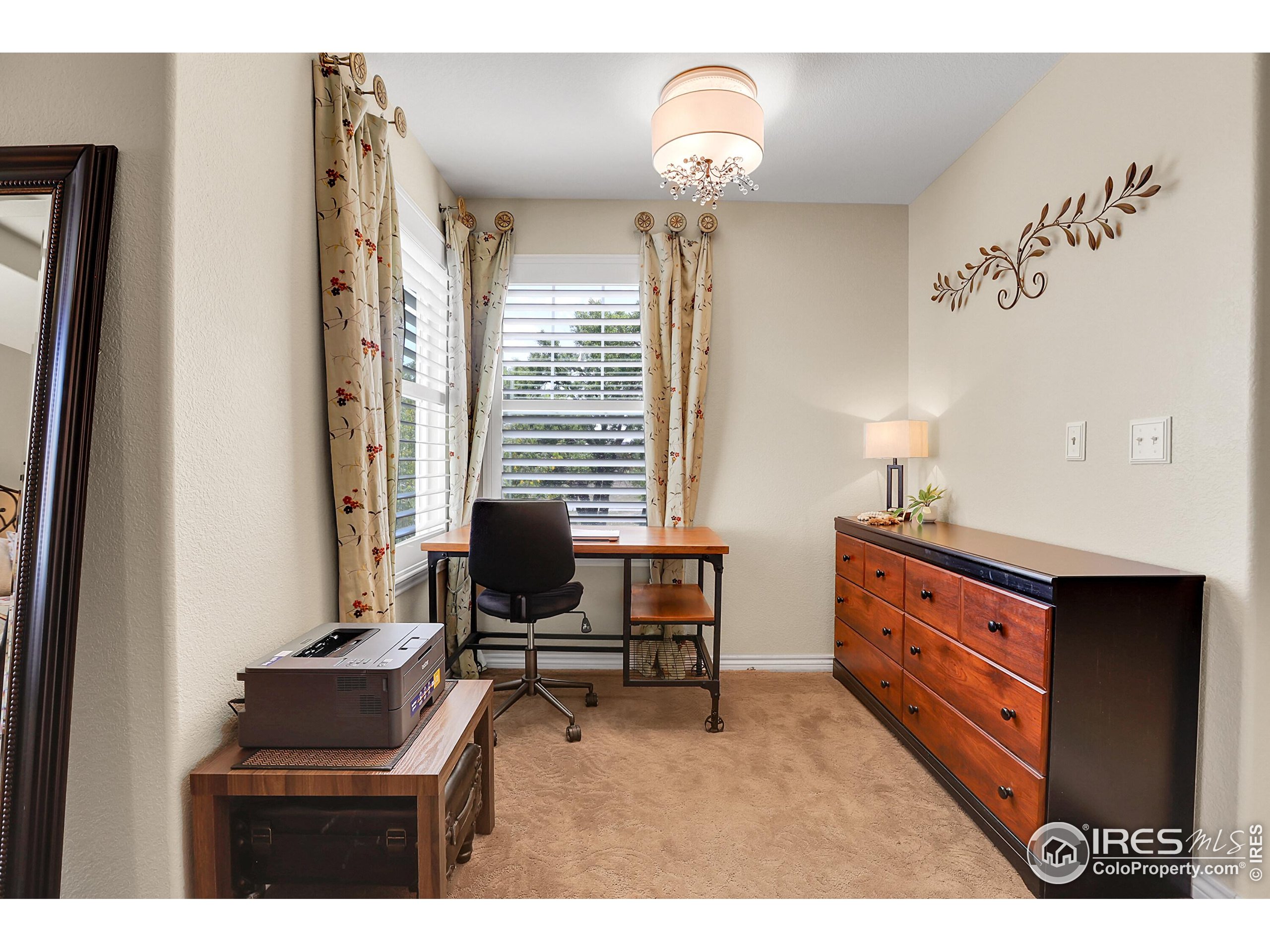 112 Austin Avenue Erie, CO 80516 - Photo 29 of 44 a room with furniture and a window
