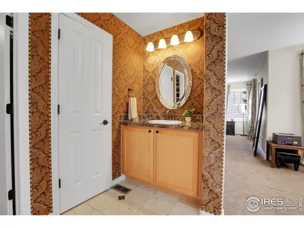 a bathroom with a tub sink shower and mirror