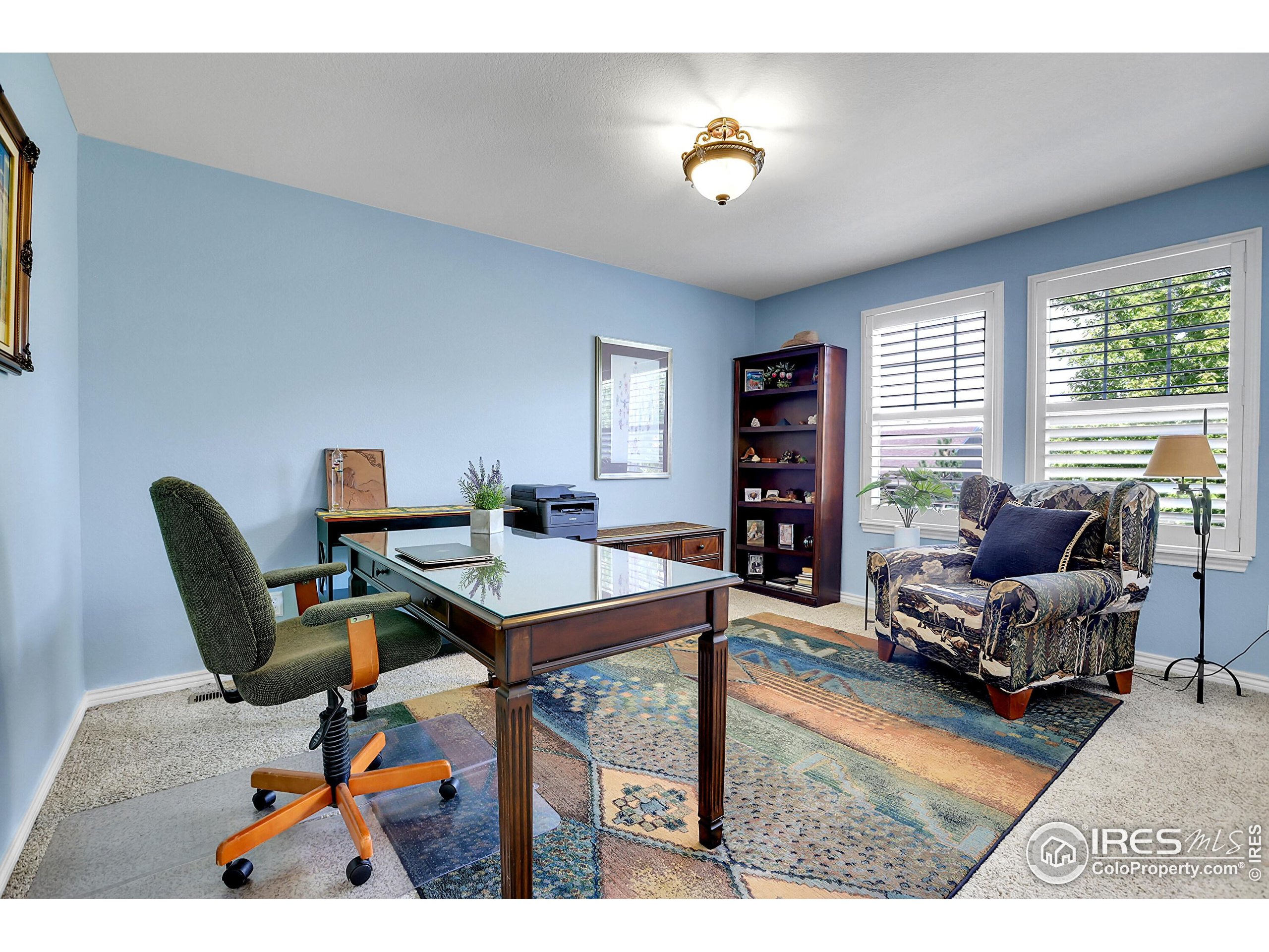 112 Austin Avenue Erie, CO 80516 - Photo 34 of 44 a living room with furniture and a flat screen tv