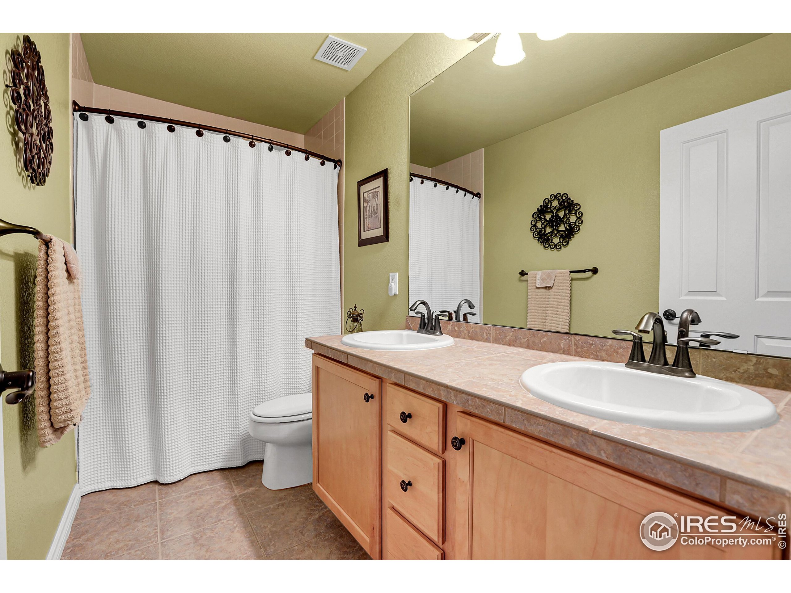 112 Austin Avenue Erie, CO 80516 - Photo 35 of 44 a bathroom with a double vanity sink mirror and toilet