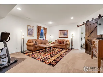 a bedroom with a bed lamp and a window