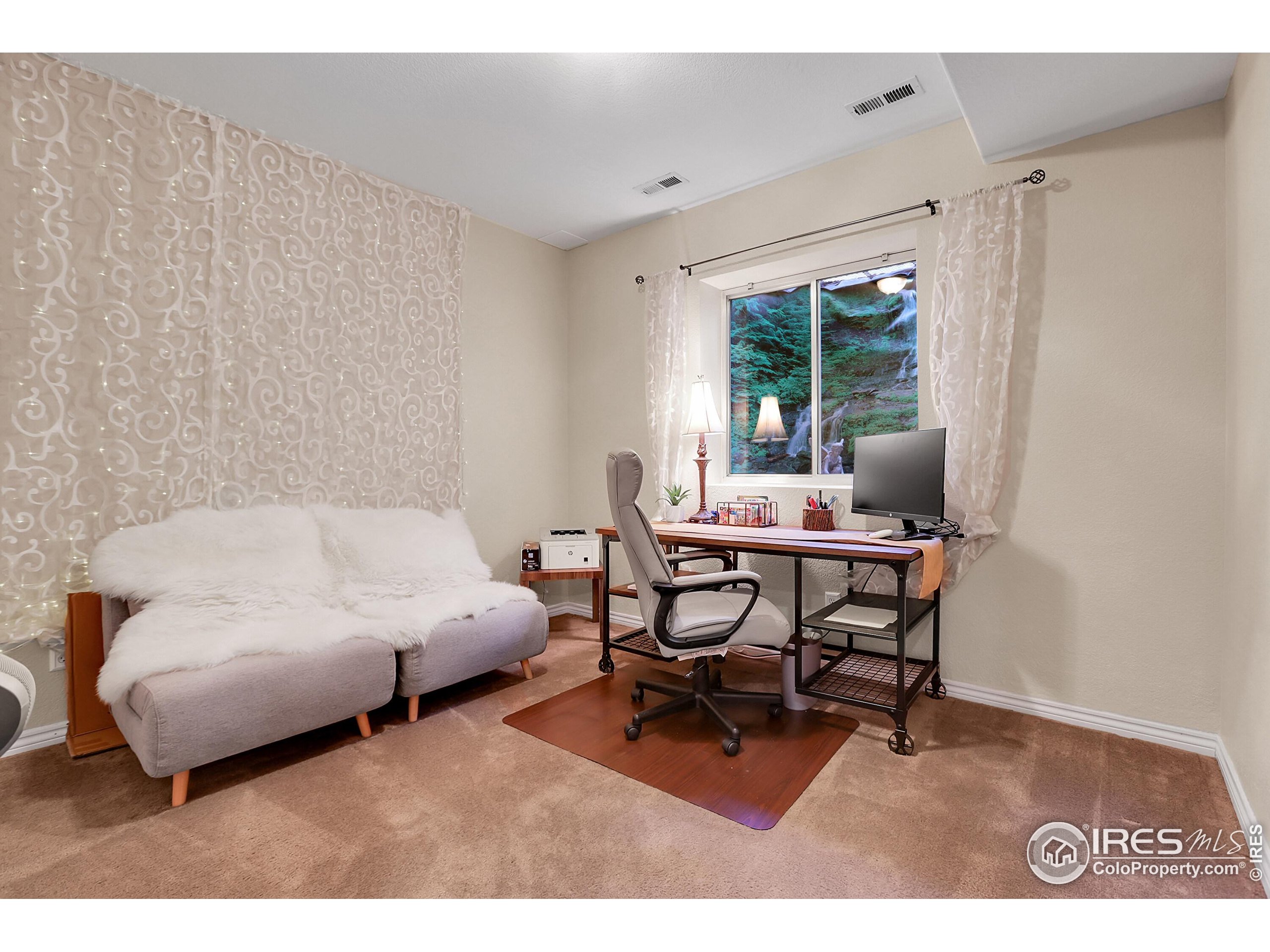 112 Austin Avenue Erie, CO 80516 - Photo 39 of 44 a living room with furniture and a large window